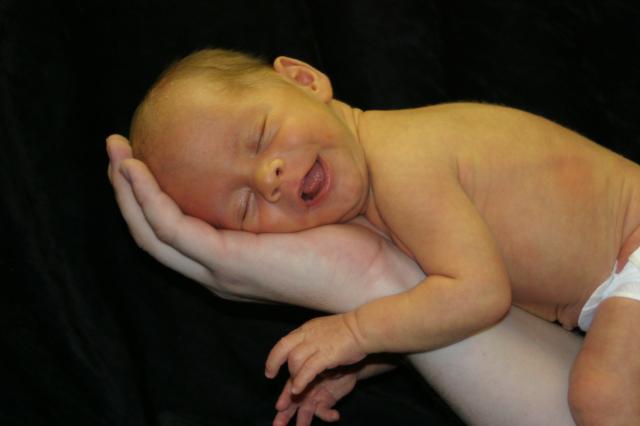 Looks like he's trying to play the piano, doesn't he?