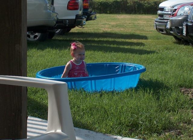 Charli "swimming" (in an empty pool)
