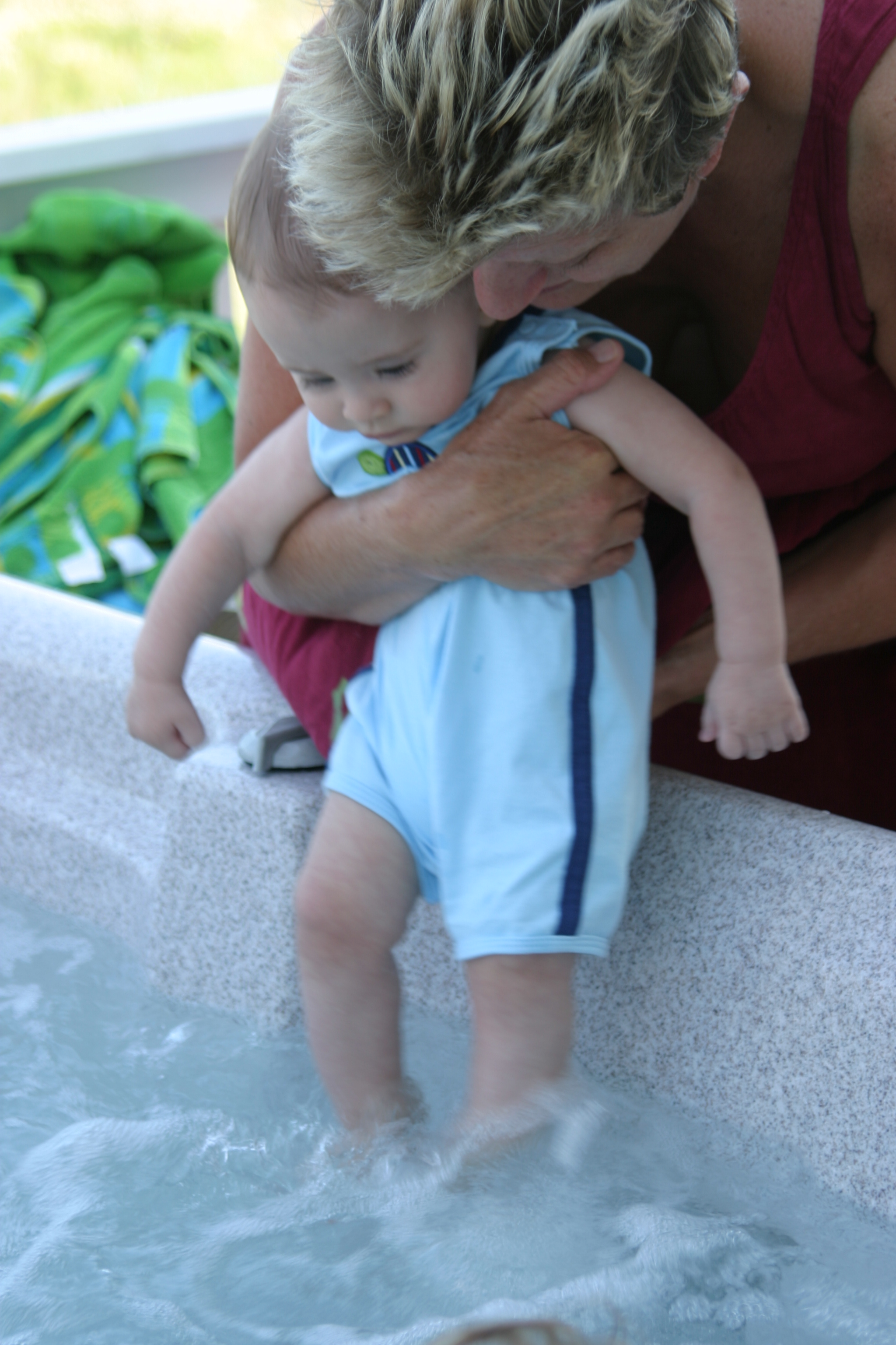 Dipping his toes in the hot tub