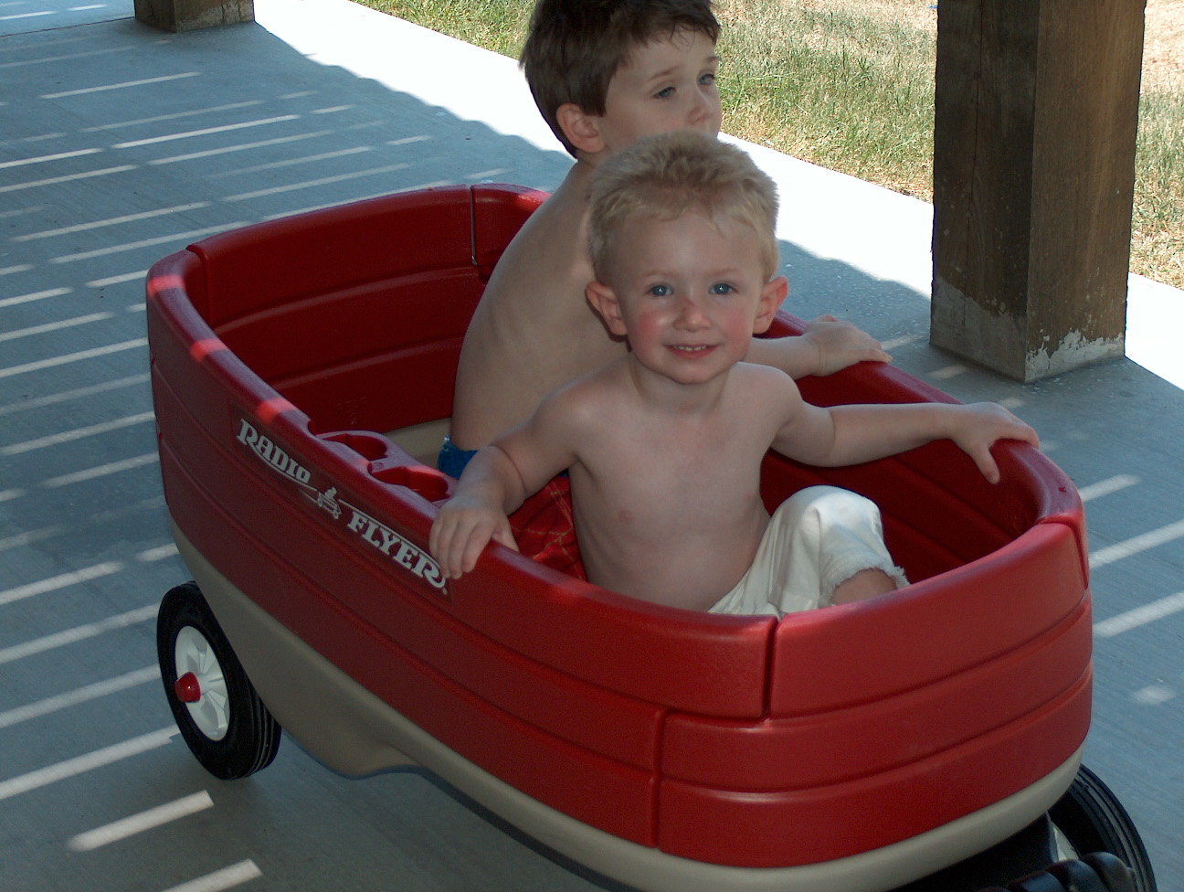 The birthday boy (and his friend) getting a ride in the wagon!
