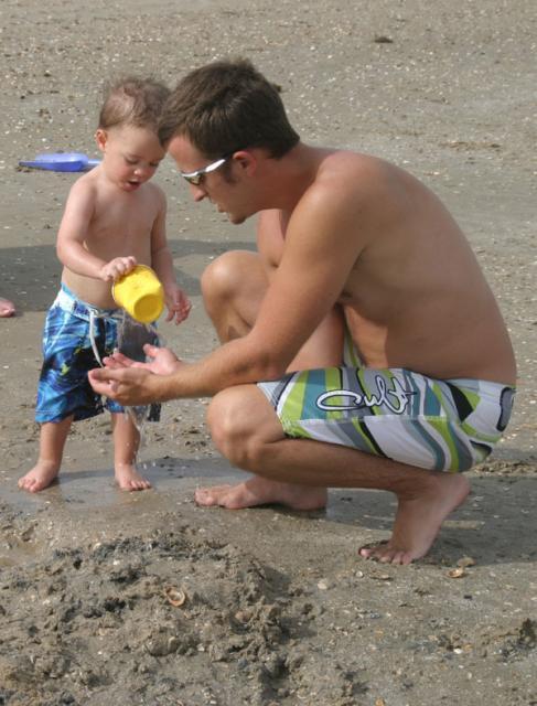 In the bath or at the beach, cups are the best toys!