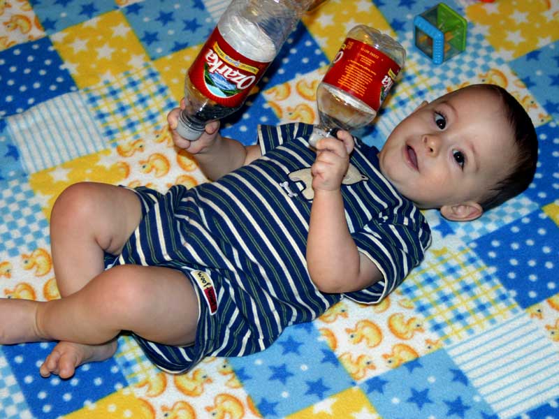 Water bottles make great toys! ~ August 3, 2006
