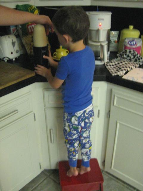 Helping Daddy make a protein shake ~ August 28, 2009
