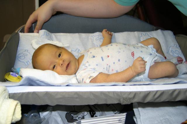 Playing with Daddy before a diaper change ~ February 3, 2006