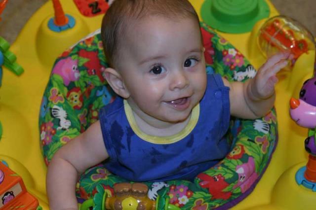 Being cute in the exersaucer ~ June 19, 2006