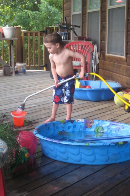 Playing on the porch at Coco & Papa's ~ June 7, 2009