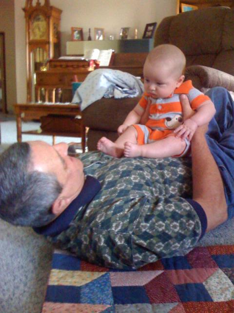 Papa makes a good chair ~ June 26, 2009