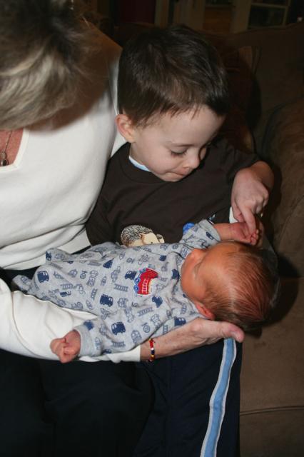 Look, he's holding my hand! ~ March 3, 2009
