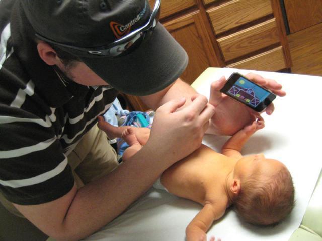 Checking out Daddy's iPod ~ March 17, 2009