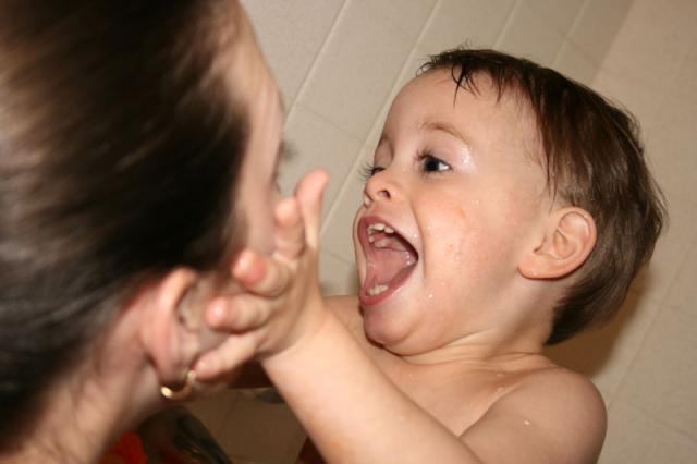 He loves to squish the air out of my cheeks -- boys will be boys! ~ January 8, 2008