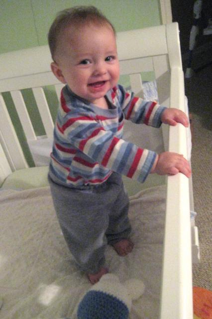 Look, Mom, it's time to lower my crib mattress! ~ November 8, 2009