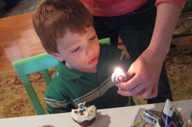 Everyone gets a turn blowing out the candle