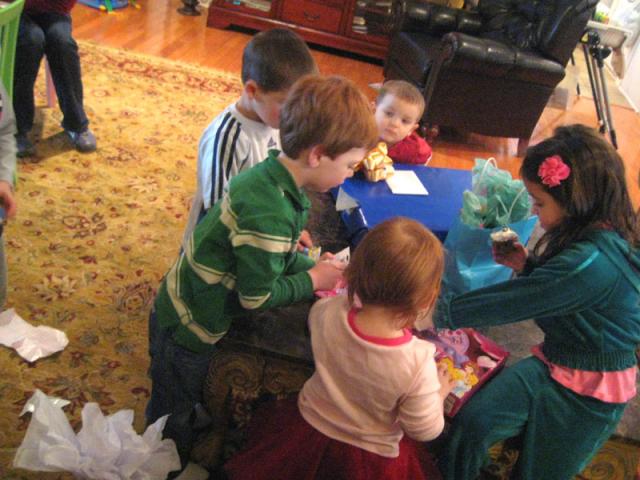 Opening presents is always a group activity at a Cantrell birthday