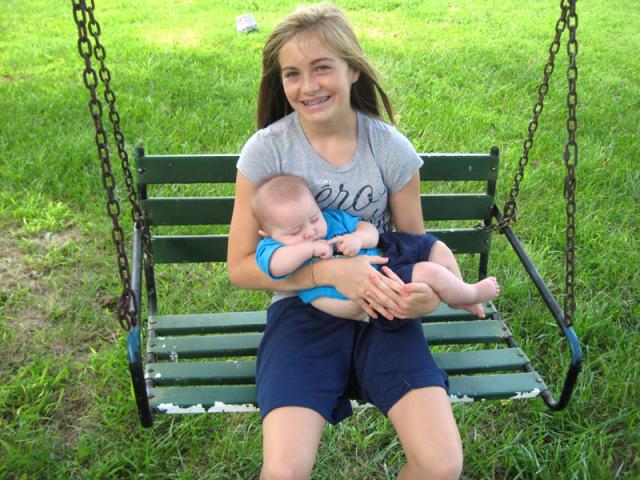 The Amazing Addison rocked Oliver to sleep on the swing!