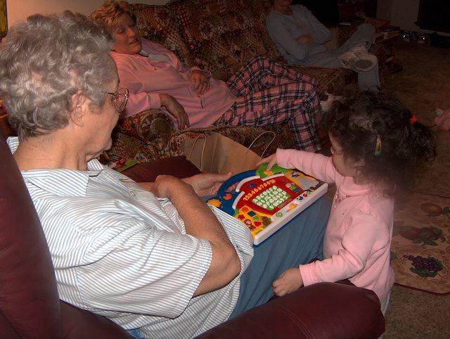 Ana showing Memaw how to play