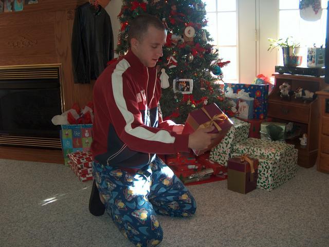 John playing Santa (and complaining about all the presents for Ty)