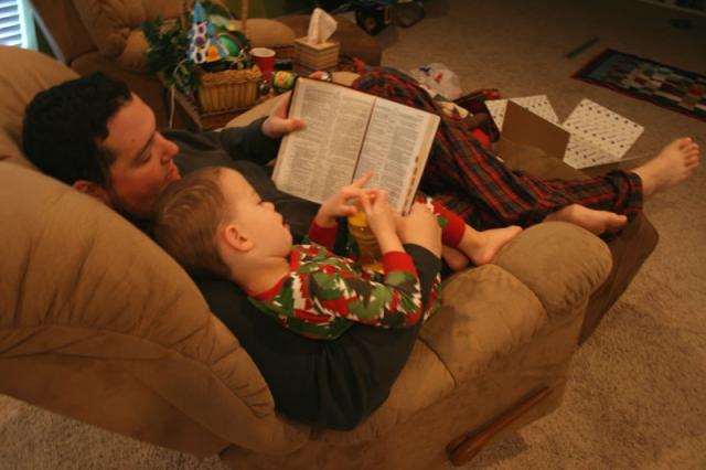 Reading the Christmas story from the Bible on Christmas morning