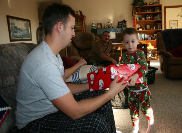 Santa Tyler handing out presents