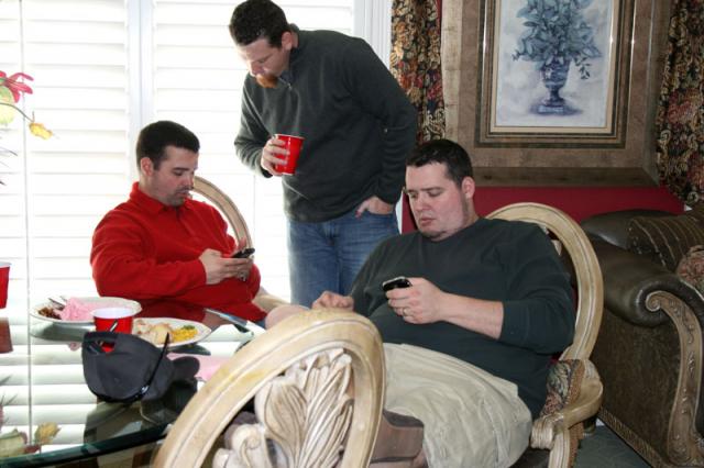 Boys comparing cell phones