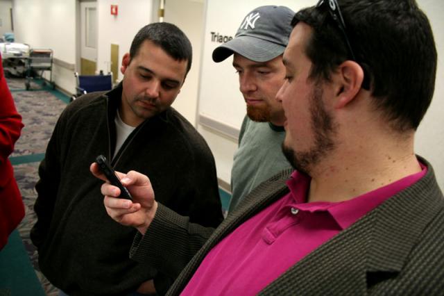 Checking out the baby or the phone?