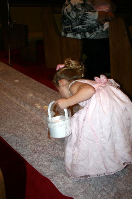 Emmy started cleaning up petals after the ceremony