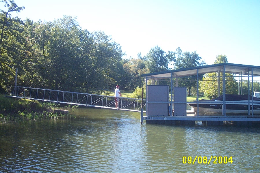 Kevin Fishing off the Neighbor's Dock