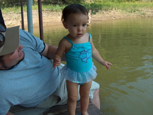 Showing off her fish/ballerina swimsuit!