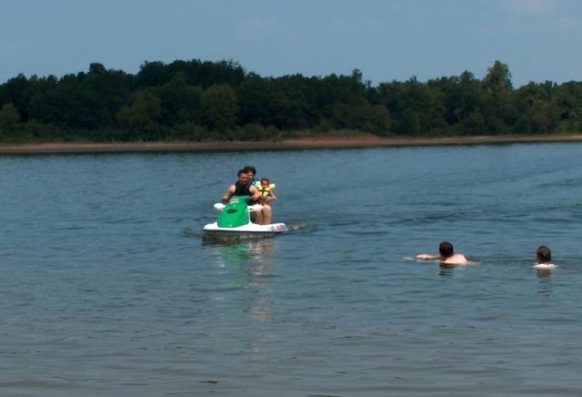 Kevin, Judy & Gracie on the Sea Doo (and Kyle and Daniel, I think, in the water)