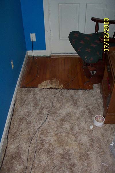 The first square of carpet ripped up