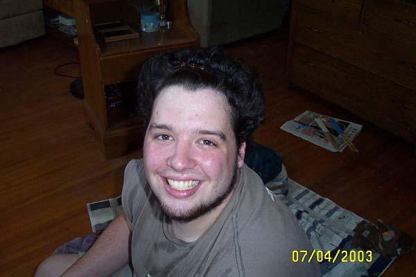 Check out that hair...had to clip it up to get it out of his face!