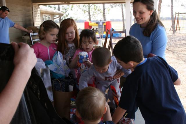Opening presents is a group effort