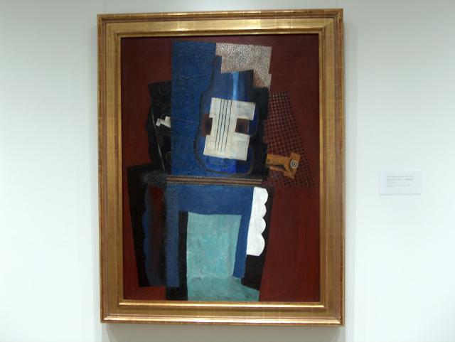 Guitar and Clarinet on a Mantelpiece by Pablo Picasso