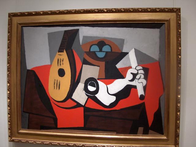 Mandolin, Fruit Bowl, and Plaster Arm by Pablo Picasso