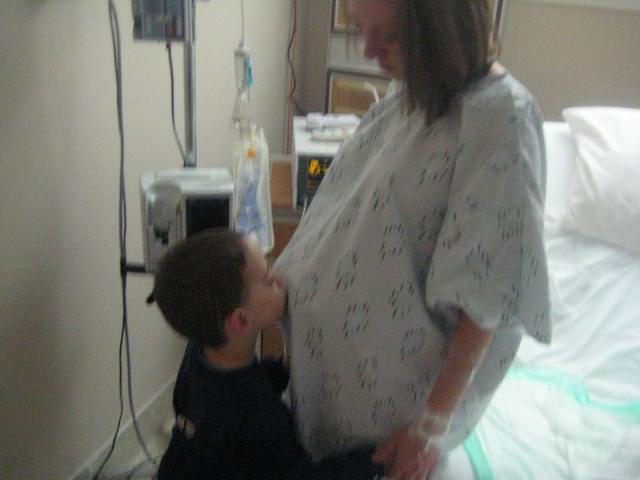 One last kiss for the baby in Mama's belly