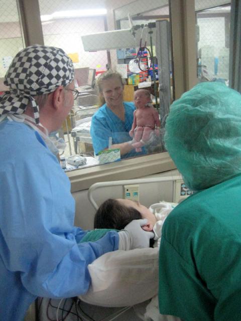 Mama gets her first look at baby Oliver