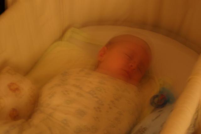 ...but by the time I get up to check on him, he's back asleep. (Blurry picture because I didn't want to use the flash.)