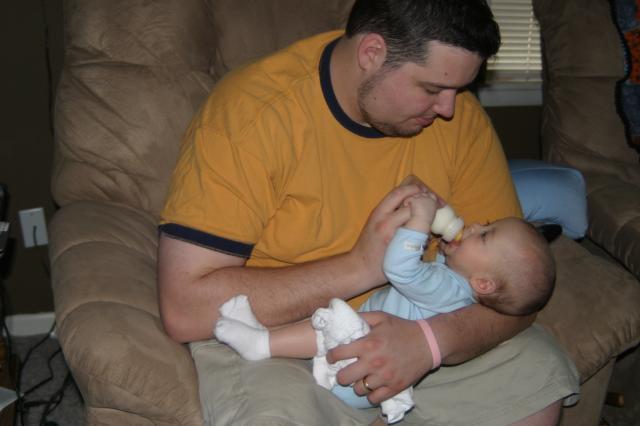 Tyler gets a bottle from Daddy