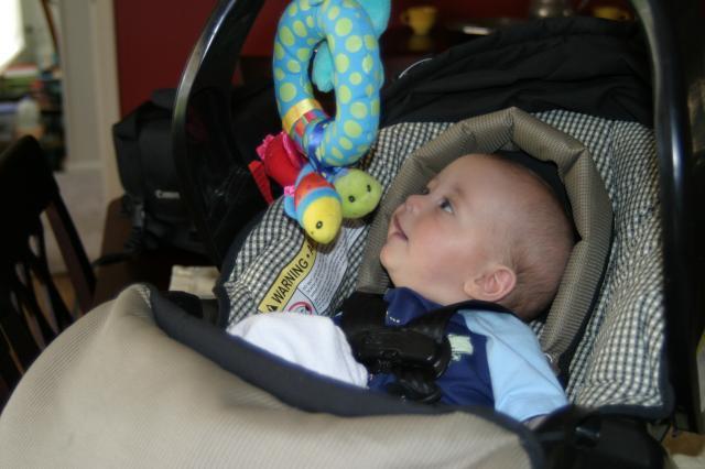Talking to his carseat toy (he loves this thing!)