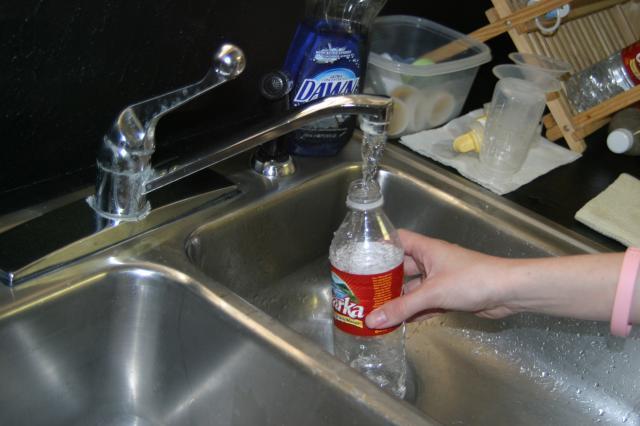 Re-filling water bottles. Yes, we're cheap and we re-fill them.