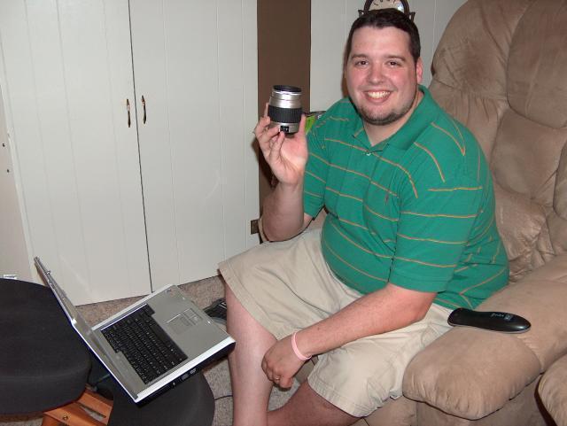 Jake's home and inspecting the camera lens I broke. Oops! Luckily, we still had our old digital camera around, so I finished my diary up with that.