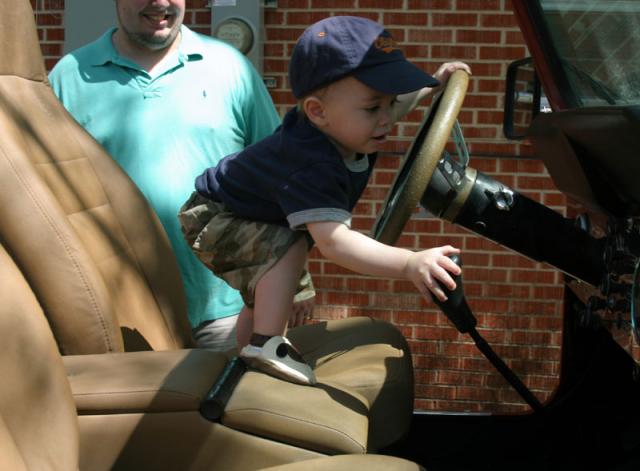 Back home, Tyler "driving" the Jeep