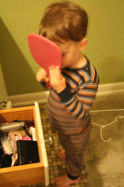 He doesn't quite understand mirrors yet