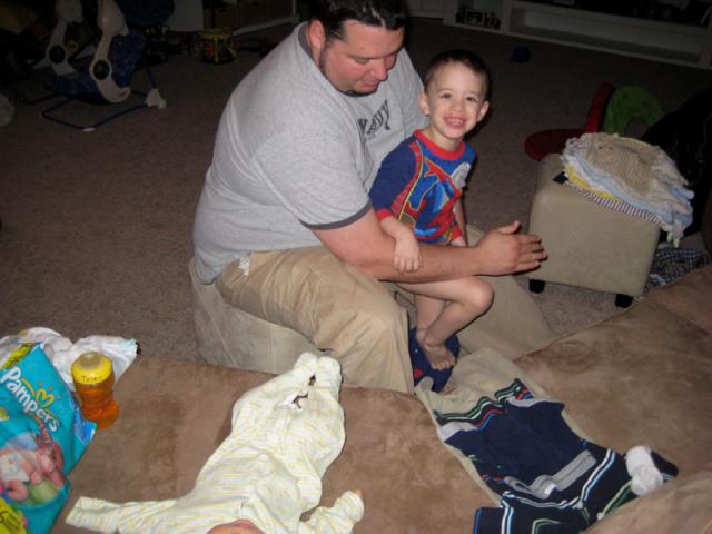 Wrangling Tyler out of his pajamas