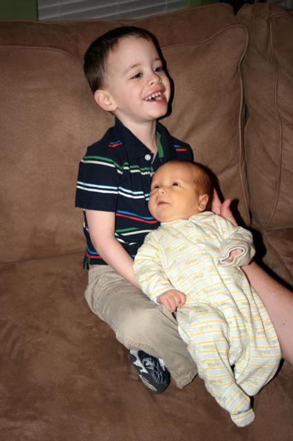 He NEEDED to hold baby brother