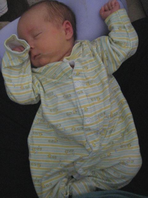 In a milk coma (that's milk dribbling down his cheek)