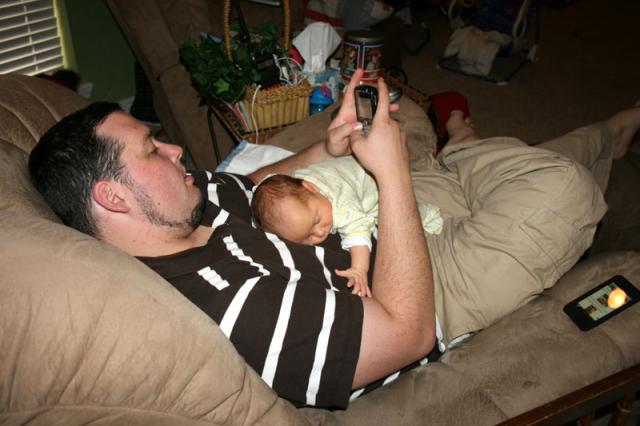 Oliver gets passed off to Daddy...