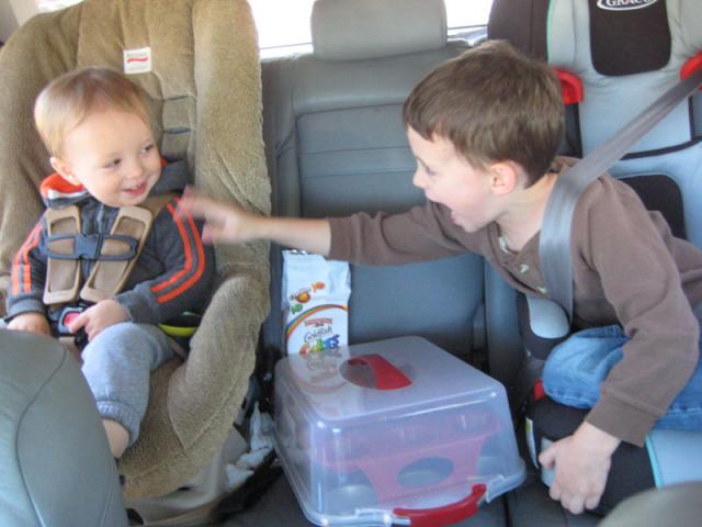 Brotherly backseat silliness