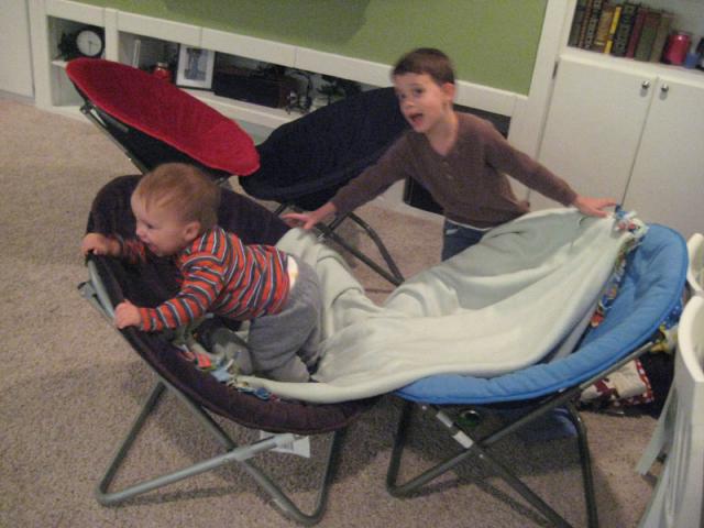 Attempting to build a house as Oliver crashes it as fast as Tyler can build