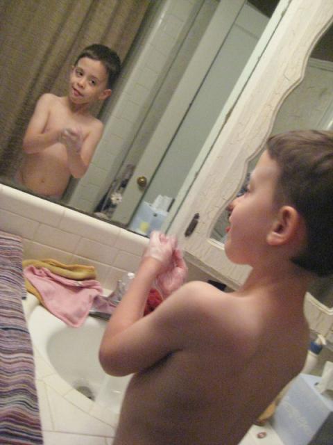 Washing off the chalk and checking himself out in the mirror