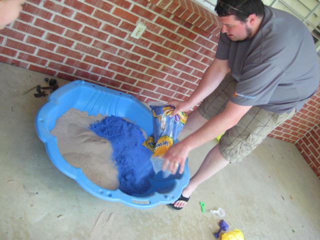 Putting in the new colored sand